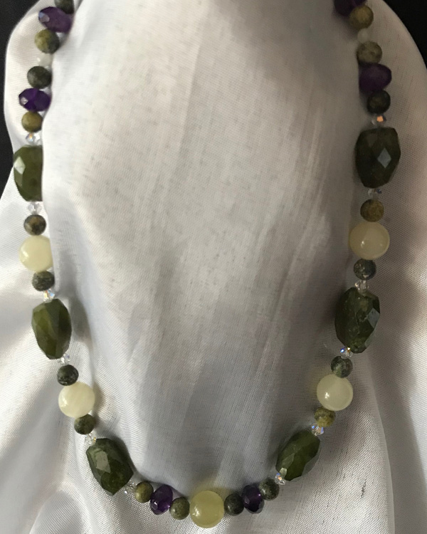 Olive Green Dioptase with Amethyst.